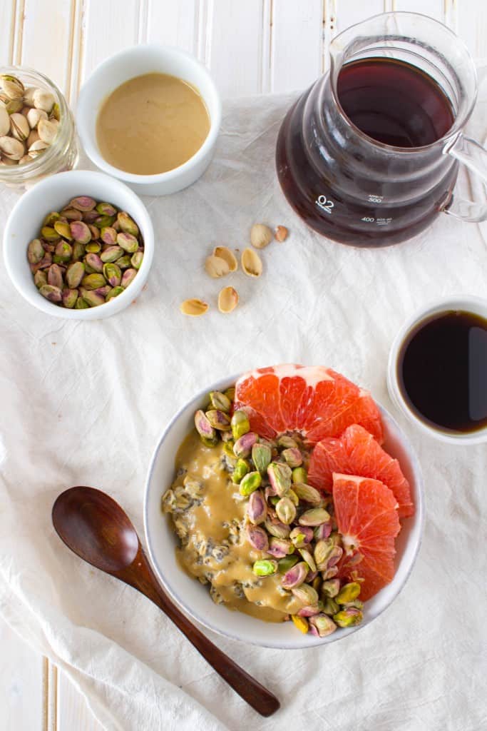 Breakfast Oatmeal Bowl with Grapefruit, Pistachios, + Sweet Tahini Drizzle. A vegan and gluten free healthy breakfast recipe from The Grateful Grazer.