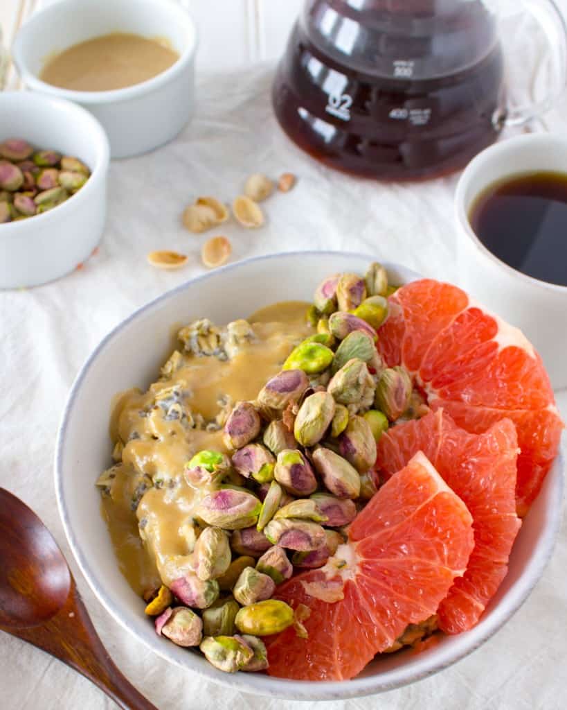 Breakfast Oatmeal Bowl with Grapefruit, Pistachios, + Sweet Tahini Drizzle. A vegan and gluten free healthy breakfast recipe from The Grateful Grazer.