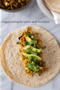 Vegan tempeh tacos and burritos are a favorite healthy, plant-based weeknight meal. Quick, filling, and (of course) delicious too, this meal has all the makings of a heathy homemade staple.