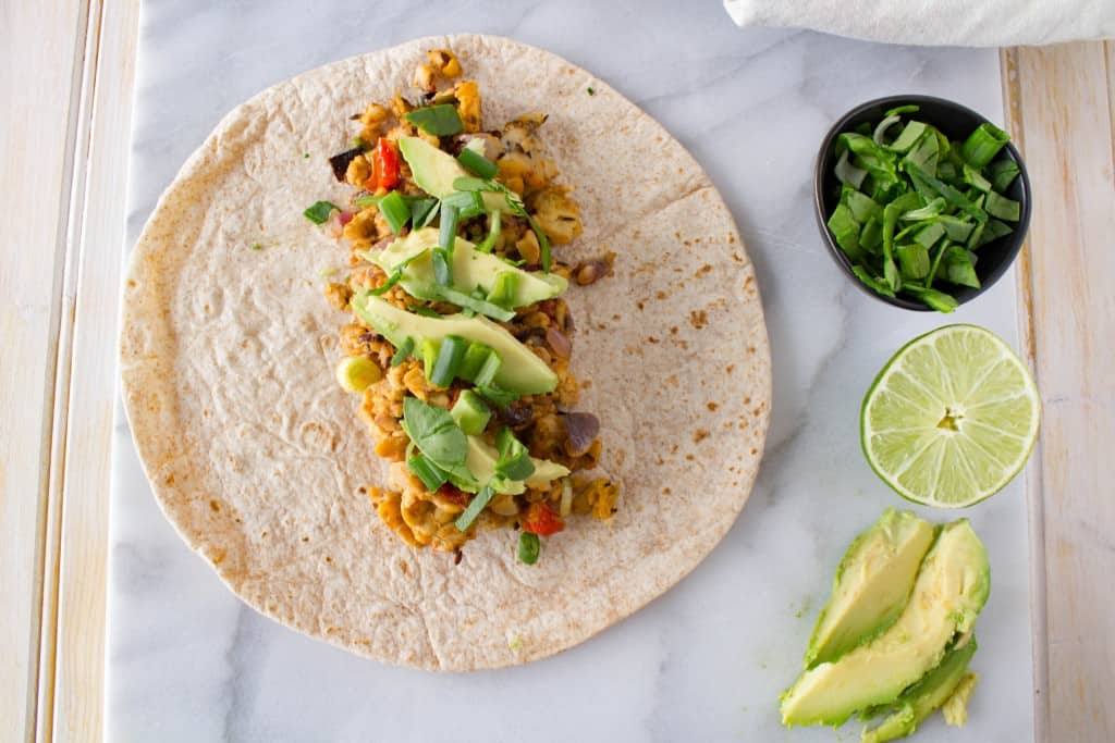 Vegan tempeh tacos and burritos are a favorite healthy, plant-based weeknight meal. Quick, filling, and (of course) delicious too, this meal has all the makings of a heathy homemade staple.