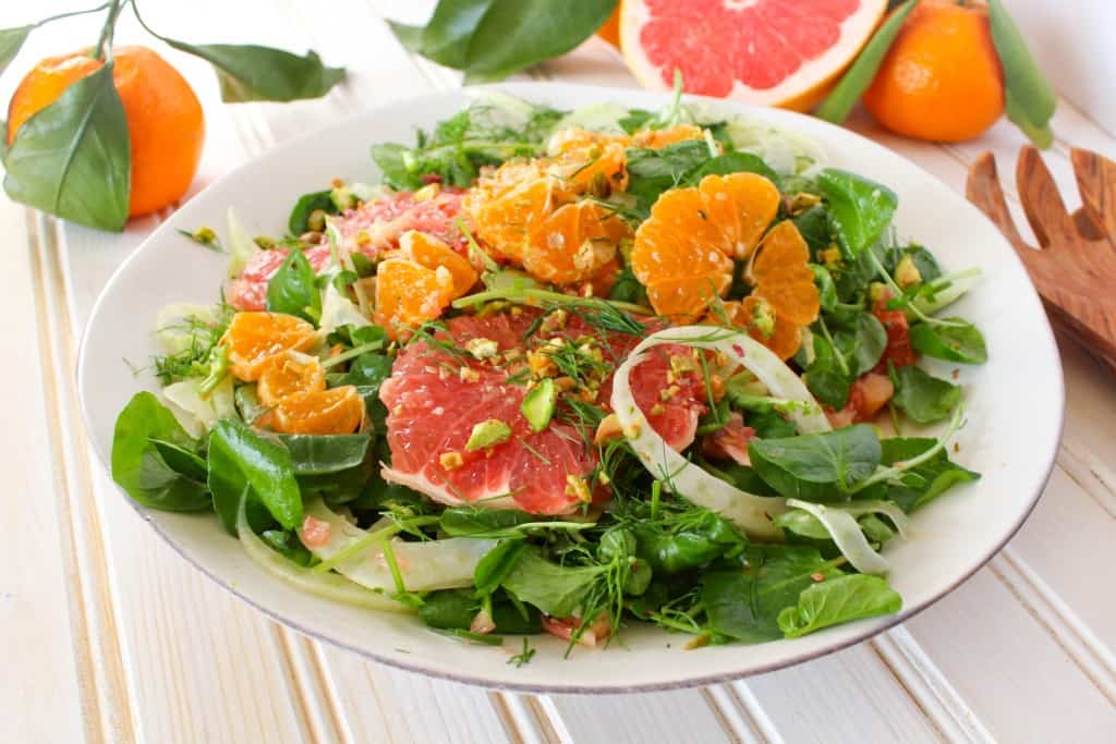 Winter Citrus Salad recipe made with grapefruit, satsuma orange, watercress, fennel, and topped with pistachios. Vegan and gluten free. The Grateful Grazer