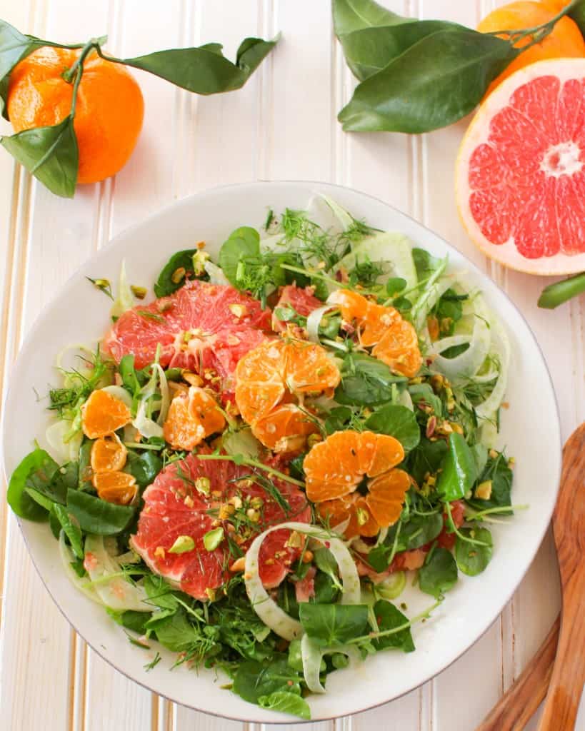 Winter Citrus Salad recipe made with grapefruit, satsuma orange, watercress, fennel, and topped with pistachios. Vegan and gluten free. The Grateful Grazer