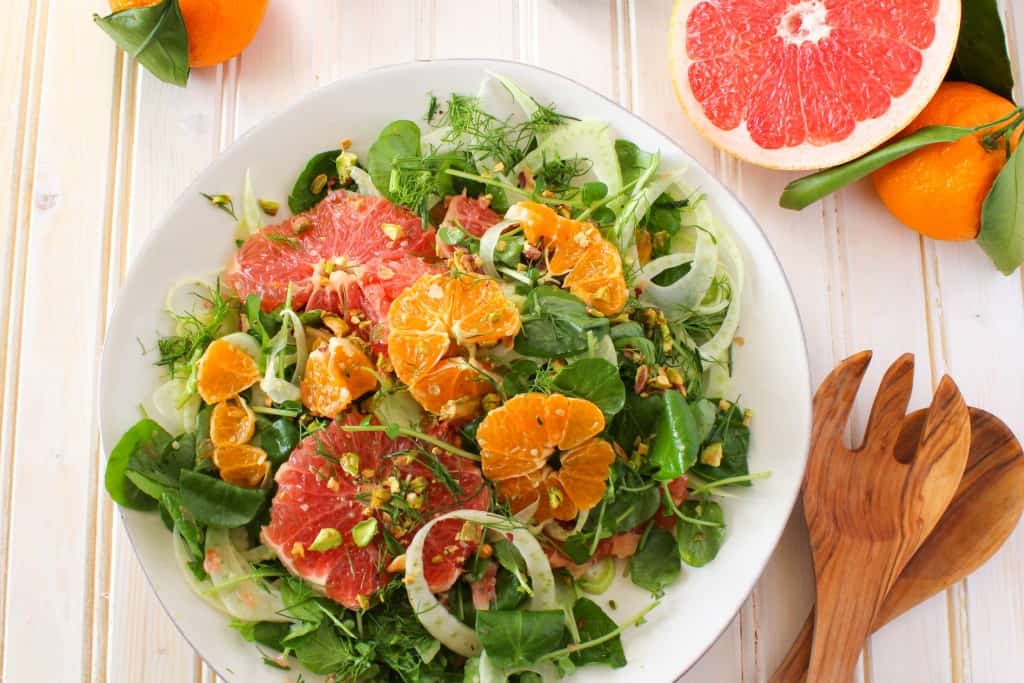 Winter Citrus Salad recipe made with grapefruit, satsuma orange, watercress, fennel, and topped with pistachios. Vegan and gluten free. The Grateful Grazer