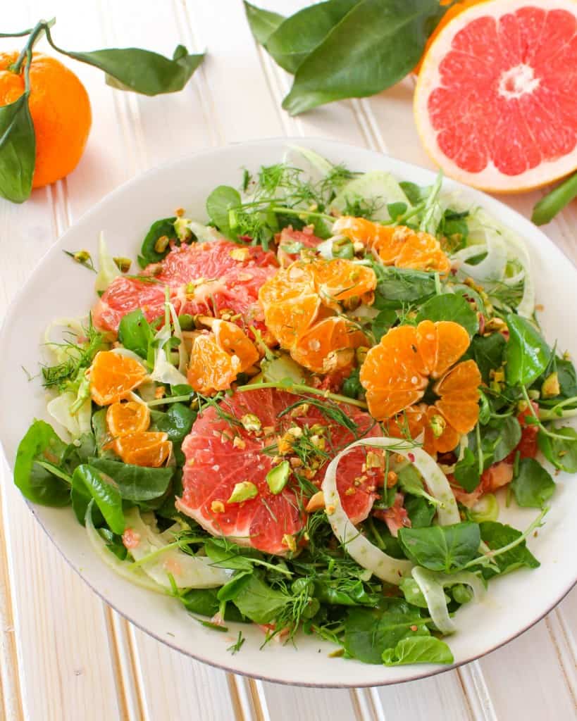 Winter Citrus Salad recipe made with grapefruit, satsuma orange, watercress, fennel, and topped with pistachios. Vegan and gluten free. The Grateful Grazer