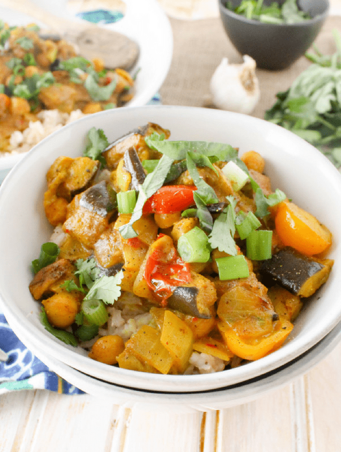Vegetarian meal prep Roasted Eggplant Coconut Curry in a white bowl.