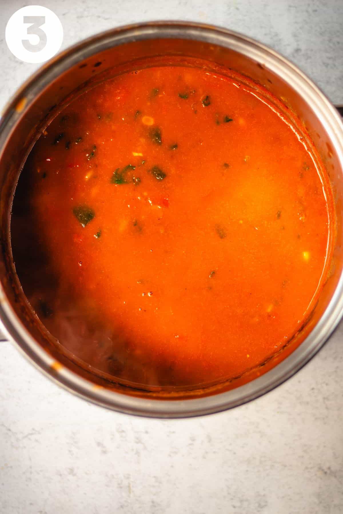 Cooking taco soup in a large pot labeled with a number "3" in the upper left corner.