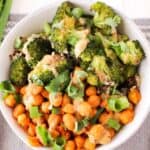 Buffalo chickpea bowl with broccoli, quinoa, and tahini sauce.