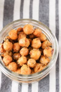 These Cheesy Roasted Chickpeas make a delicious dairy-free snack! Learn how to make cheesy, crunchy, and completely plant-based roasted chickpeas.