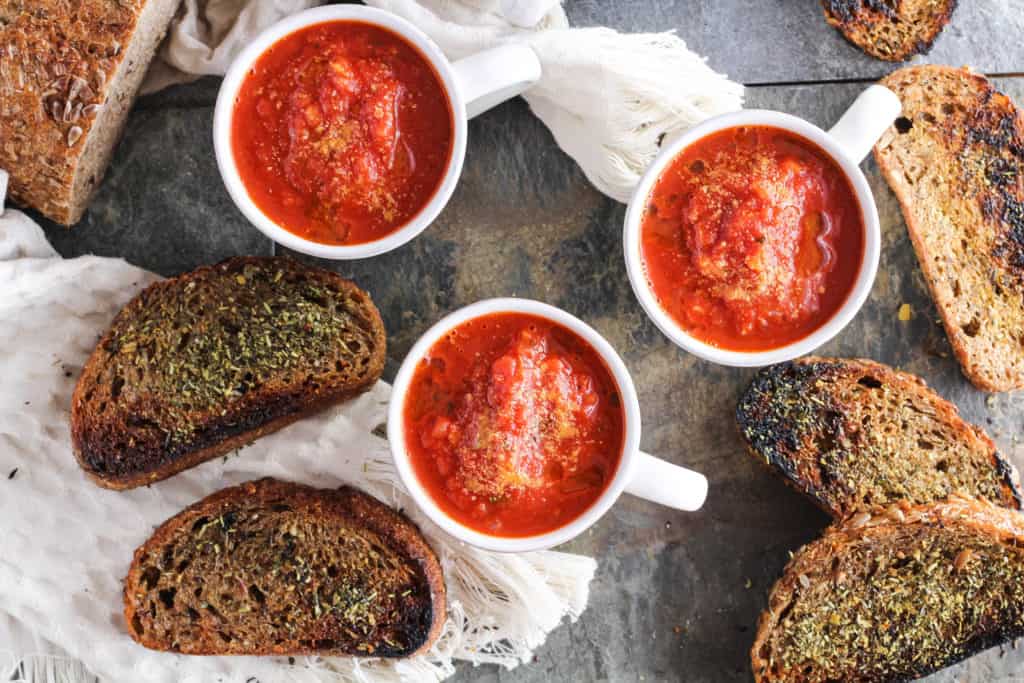 Delicious vegan recipe for easy tomato soup served with homemade fried whole grain bread. Healthier plant-based comfort food for fall!