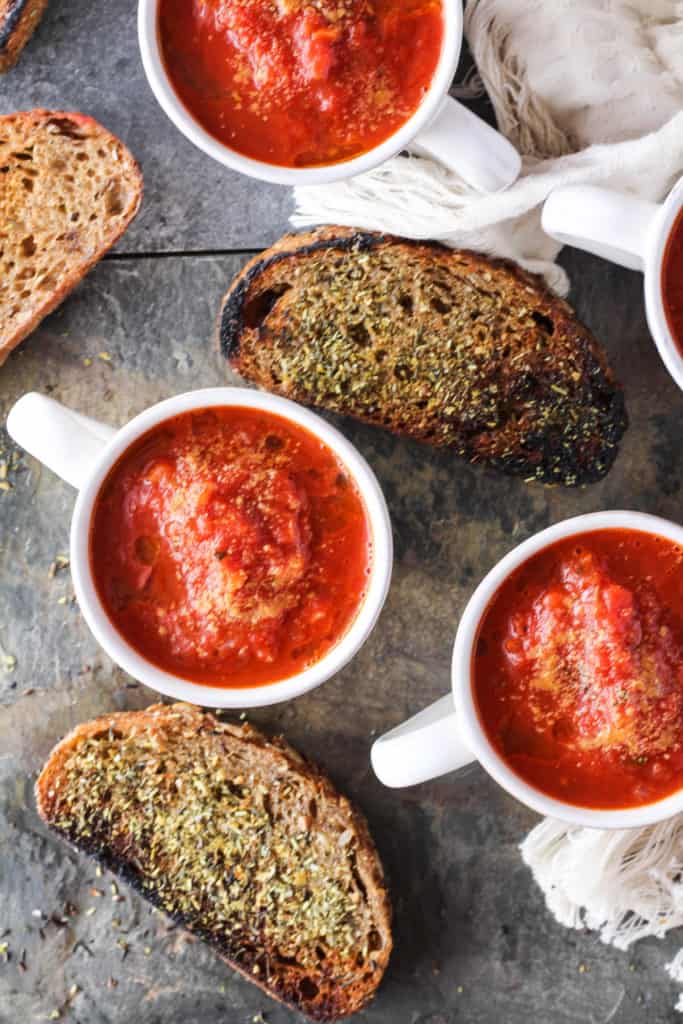 Delicious vegan recipe for easy tomato soup served with homemade fried whole grain bread. Healthier plant-based comfort food for fall!