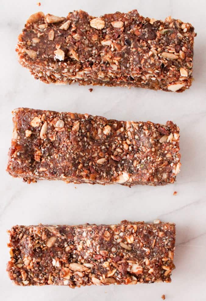 Vegetarian meal prep chocolate energy bars on white parchment paper.