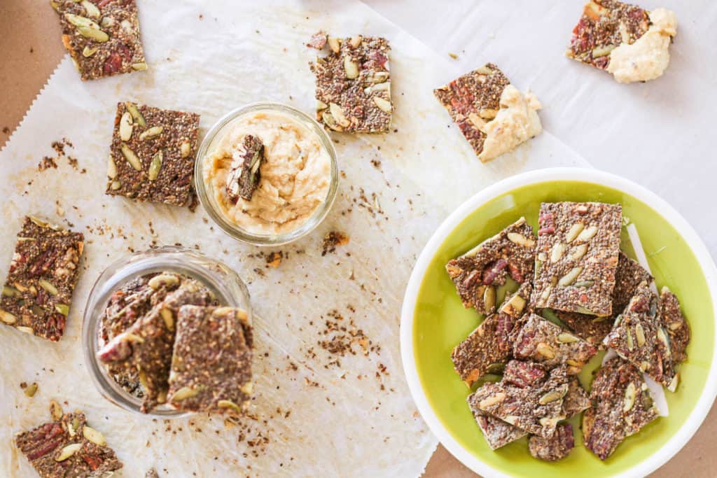 Make your own chia seed crackers with this simple plant-based recipe. Healthy and delicious snack that's portable and travel-friendly!