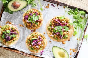 Tempeh tostadas are baked and topped with mashed avocado and soy for a quick healthy meal or snack that is plant-based and vegan with a gluten-free option.