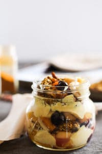 Golden milk granola is a delicious turmeric-based breakfast recipe with anti-inflammatory benefits. Mix with fruit and yogurt to make a healthy parfait!