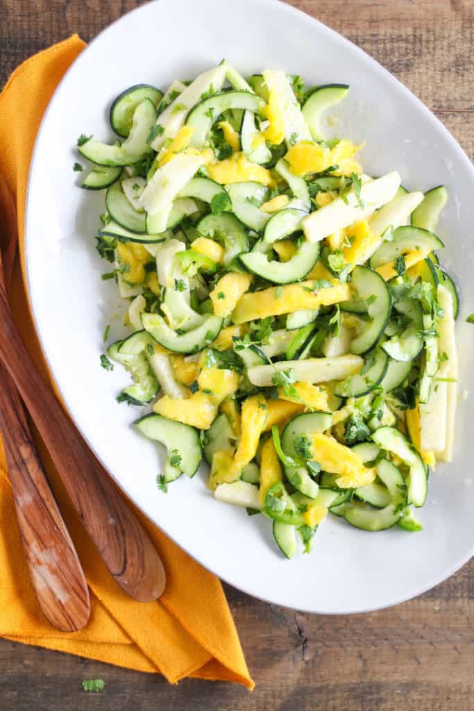 Upgrade your go-to summer fruit salad with a colorful Mango Cucumber Salad with Jicama! Easy vegan/vegetarian and gluten-free recipe!