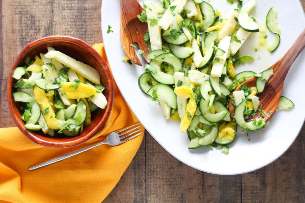 vUpgrade your go-to summer fruit salad with a colorful Mango Cucumber Salad with Jicama! Easy vegan/vegetarian and gluten-free recipe!
