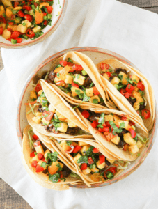 Add a little zest to your summer meals with Black Bean Street Tacos topped with Fruit Salsa!