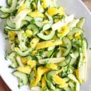 Salad with sliced mango, cucumber, jicama, cilantro, and lime.