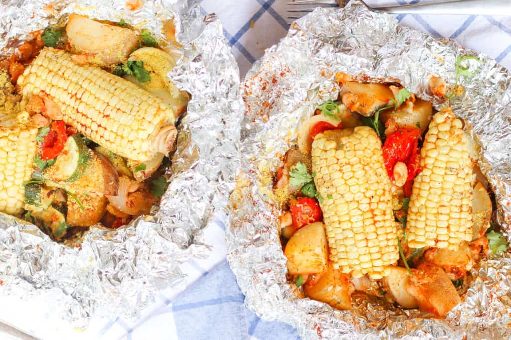 Foil packs are the easiest way to get your vegetables and plant-based protein while camping! Made with potatoes, corn, white beans, garlic, and paprika.