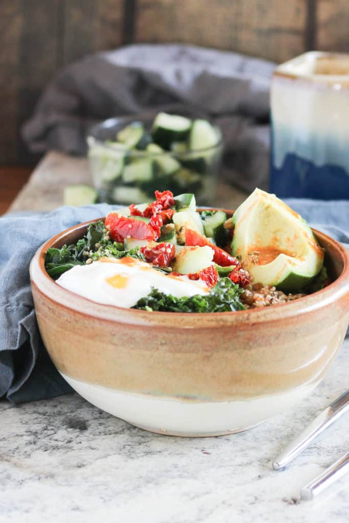 Savory breakfast bowls are a delicious way to use up last night's leftovers while fueling your body for a busy day ahead. Made with farro, kale, eggs, and miso!