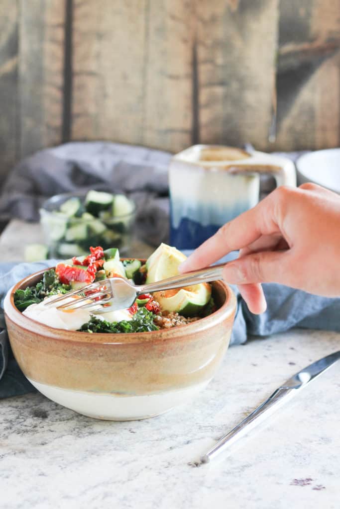 Savory breakfast bowls are a delicious way to use up last night's leftovers while fueling your body for a busy day ahead. Made with farro, kale, eggs, and miso!