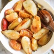 Baked apple and pear wedges a festive herb sauce.