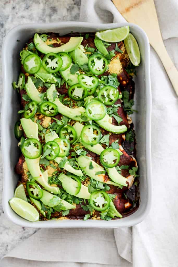 Healthy enchiladas with spinach, mushrooms, and walnuts! This delicious weeknight dinner is great for meal prep. Vegan and vegetarian recipe options.