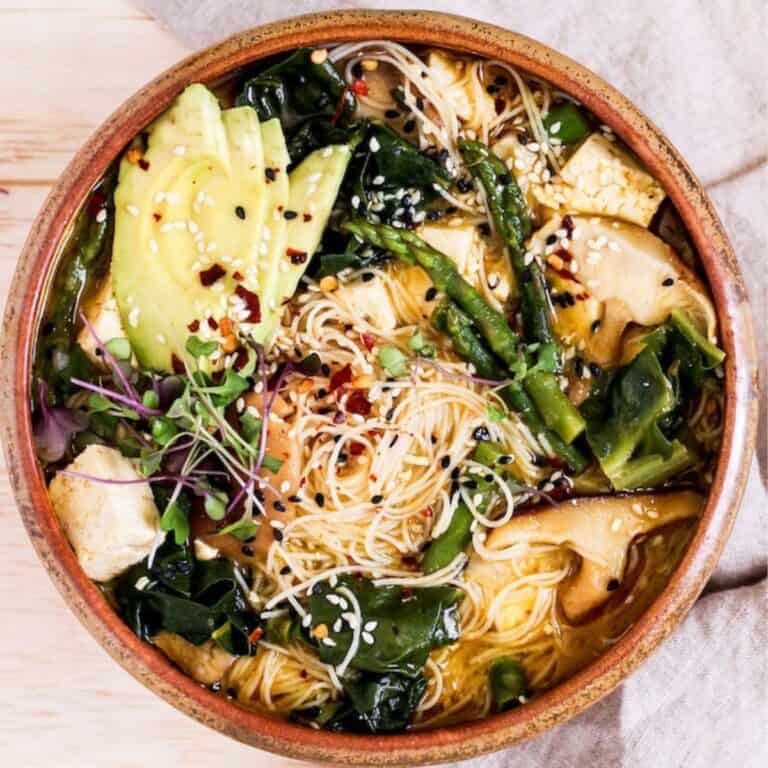 Ramen noodle bowl with asparagus, chard, and mushrooms.