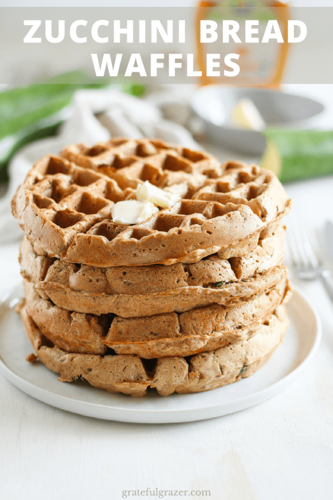 Zucchini bread waffles stacked with butter on top on a white plate. Title text reads "Zucchini Bread Waffles."