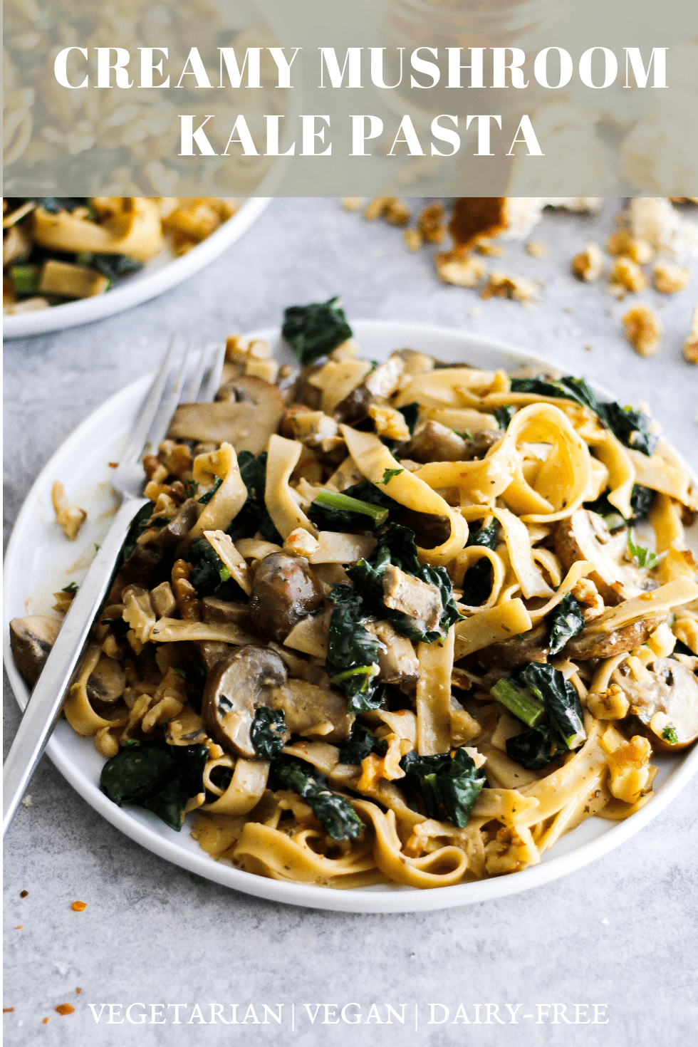 Creamy vegan pasta on white plate with text that reads, "creamy mushroom kale pasta."