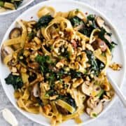 Creamy vegan pasta with mushrooms and kale.