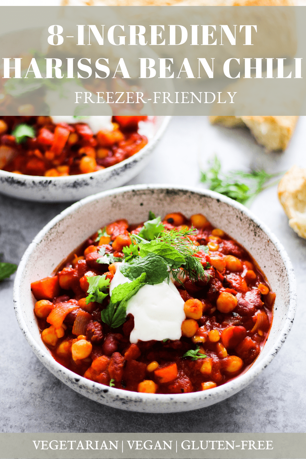 Bean chili with harissa in white stoneware bowl with white text that reads, "8-Ingredient Harissa Bean Chili: Freezer-Friendly."