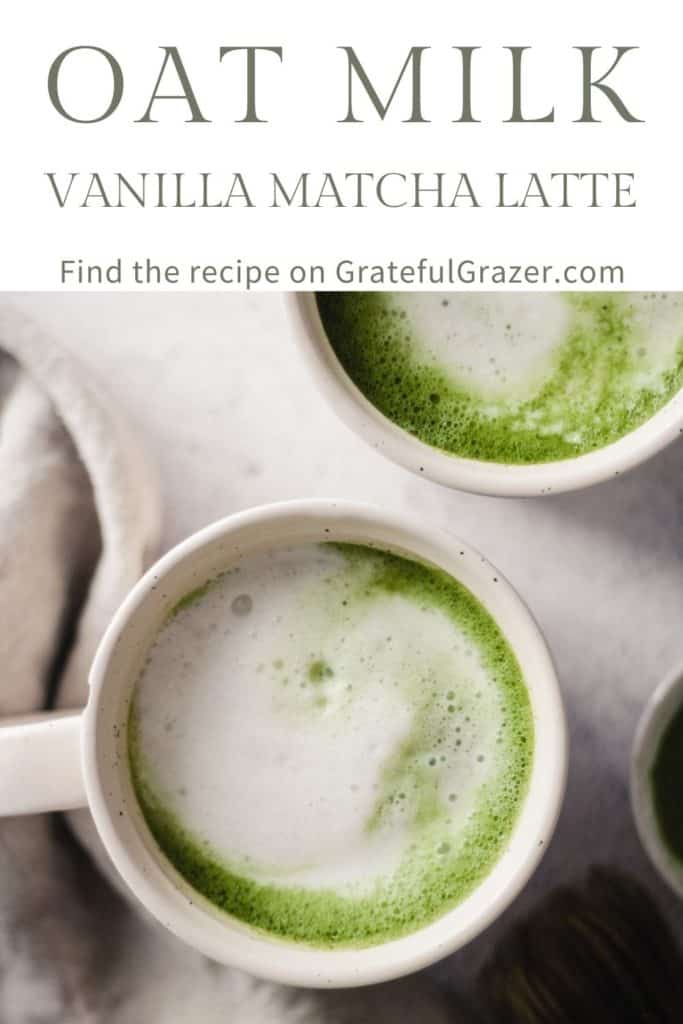 Overhead image of Vanilla Matcha Lattes in white mugs with text that reads, "Oat Milk Vanilla Matcha Latte; Find the recipe on GratefulGrazer.com."