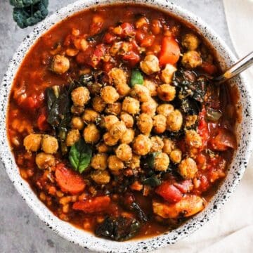 Tomato Barley Soup topped with crispy roasted chickpeas.