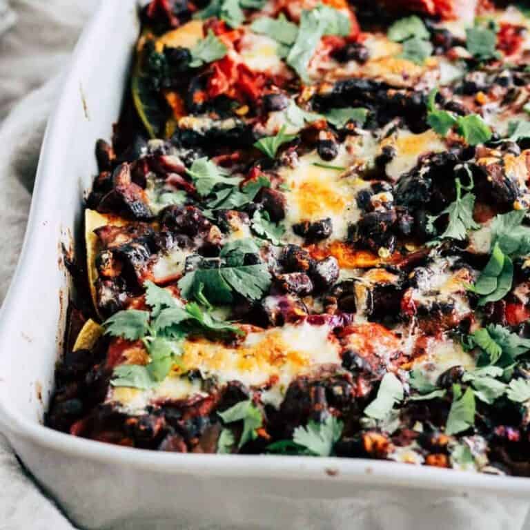 Vegetarian taco bake casserole with black beans, cheese, and fresh cilantro.