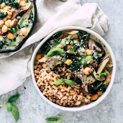 Shiitake mushroom bowls with skillet of creamy miso sauce and cream napkin.