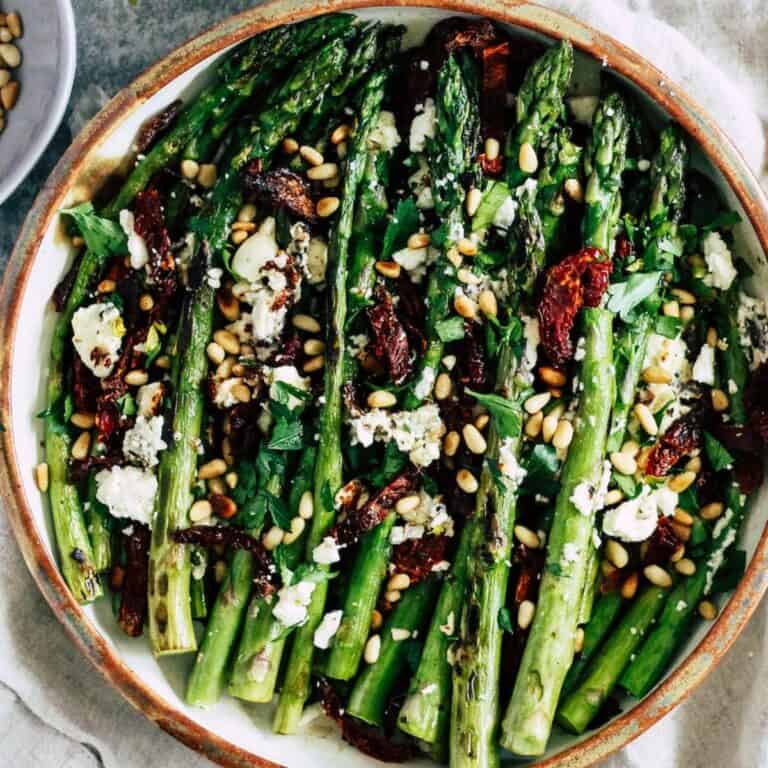 Pan-fried asparagus with sun-dried tomatoes, feta cheese, and pine nuts.
