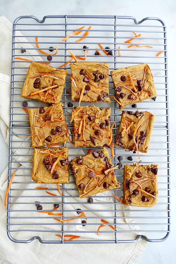 Carrot and white bean blondies on wire cooling rack. Plant-based snack ideas.