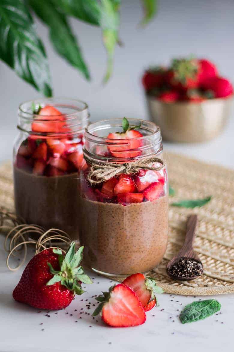 Plant-based snack ideas including chocolate chia pudding in mason jars with strawberries on top.