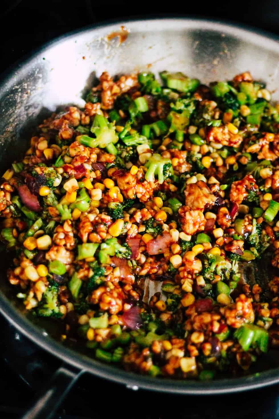 Vegetables and BBQ tempeh in skillet.