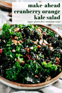Green salad with black text that reads, "make-ahead kale salad: vegan, gluten-free, make ahead recipe."