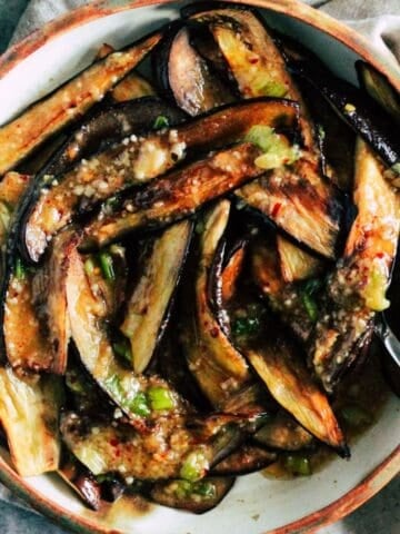 Roasted eggplant slices with miso and brown butter.