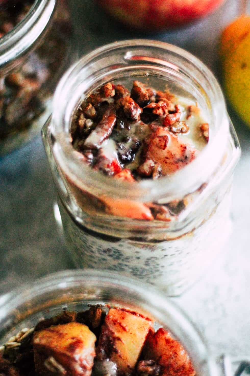 Jars filled with fruit and nuts.
