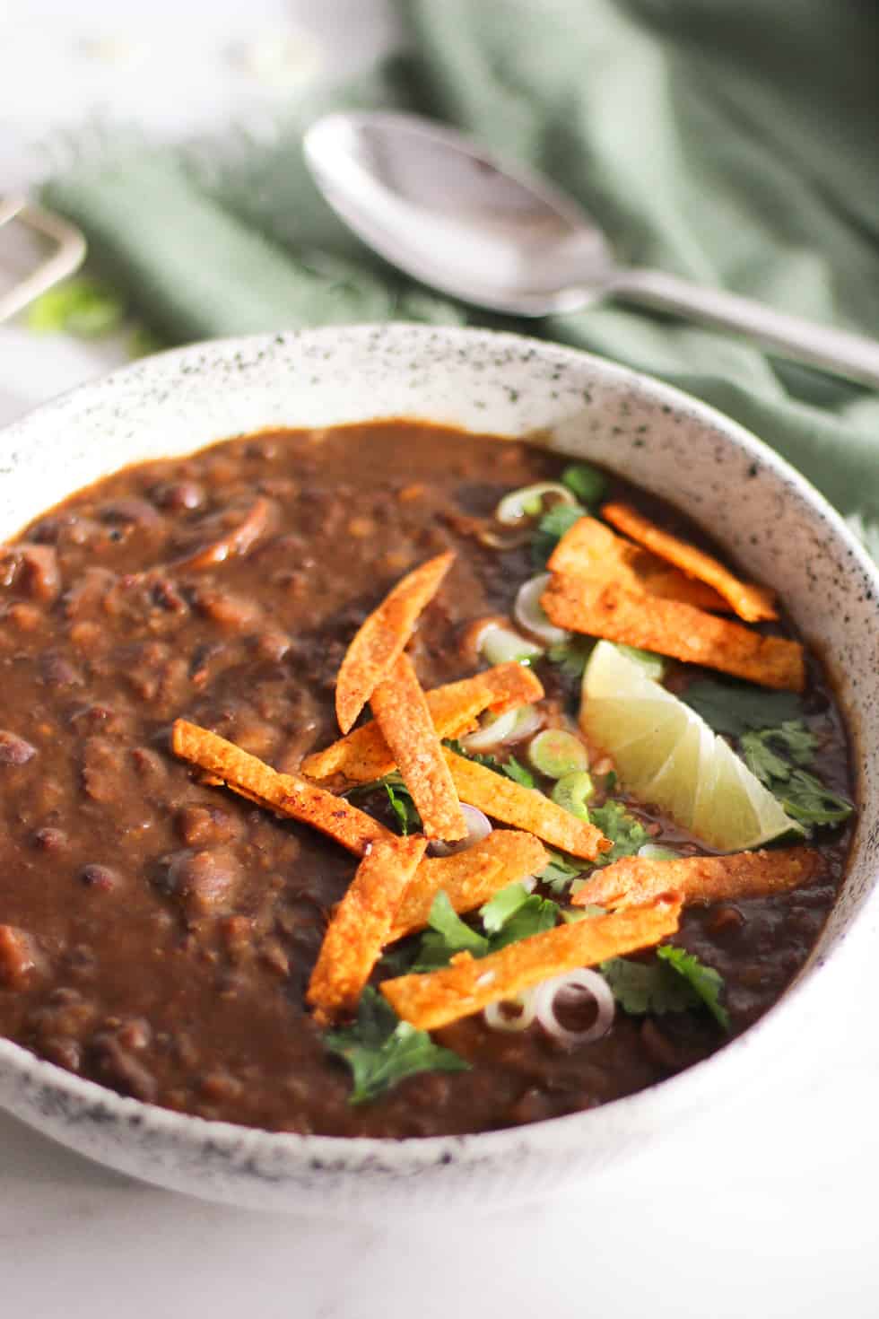 Black Bean Soup with crispy tortilla strips and lime.