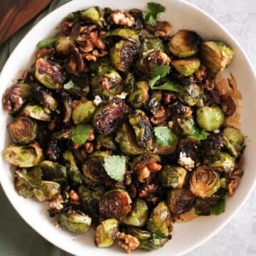 Crispy roasted Brussels sprouts with goat cheese and walnuts.