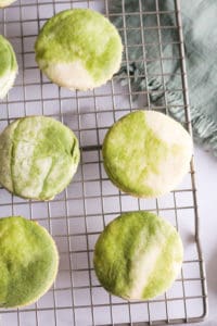 Marbled Matcha Sugar Cookies on wire rack with green napkin.