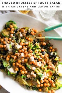 Green salad with chickpeas and text that reads, "Shaved Brussels Sprouts Salad with Chickpeas and Lemon Tahini."