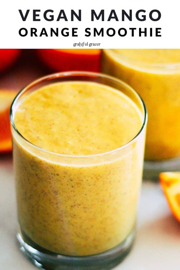 Yellow smoothie in a glass with text that reads, "Vegan Mango Orange Smoothie."