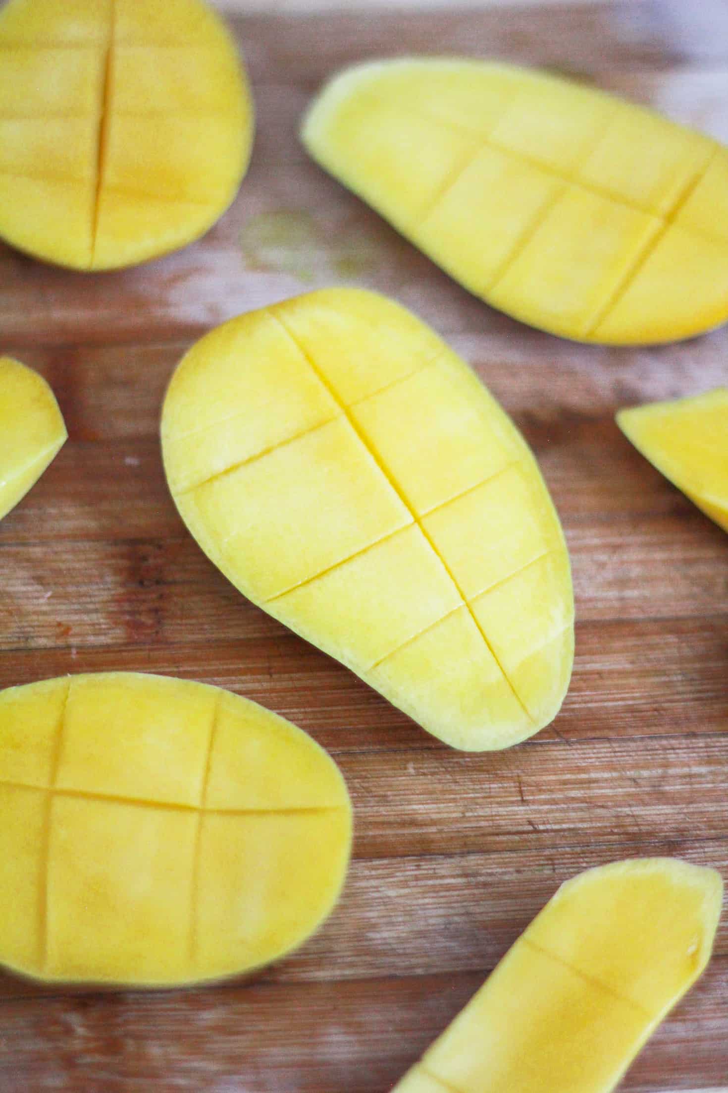 Scored mangoes illustrating how to dice a fresh mango.