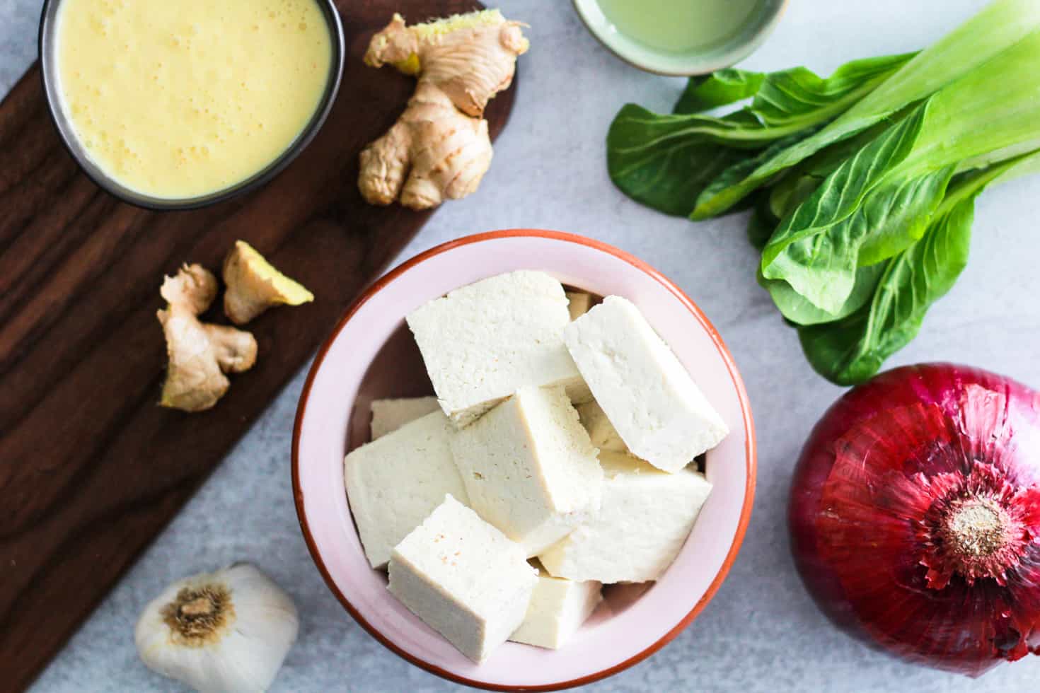 Flatlay image of tofu and mango kefir sauce ingredients. 